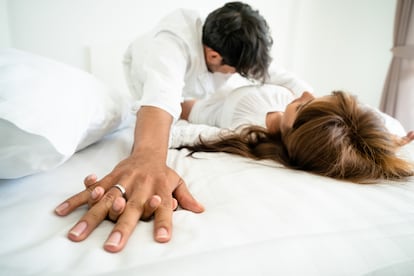 intimate young couple in home bedroom