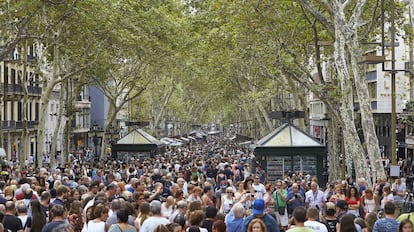 Visitors on La Rambla after last week's attack.