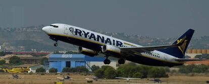 A Ryanair plane takes off at the airport, one day before a cabin crew strike to be held in four European countries on July 25 and 26, in Valencia