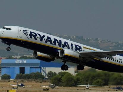 A Ryanair plane takes off at the airport, one day before a cabin crew strike to be held in four European countries on July 25 and 26, in Valencia