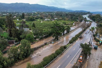 Water floods part of a road by the San Ysidro creek on Jameson Lane near the closed Highway 101 in Montecito on January 10.