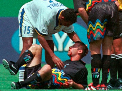 Miami Fusion's Tyrone Marshall (15) assists Kansas City Wizards' Scott Vermillion after the two collided while going up for a header in the first half of a soccer match on August 29, 1999, in Kansas City, Missouri.