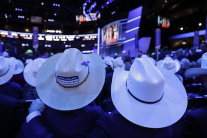 Texas delegates watch the presentation during the final day of the Republican National Convention in Cleveland, Thursday, July 21, 2016. (AP Photo/John Locher)