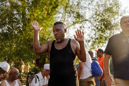 Rumba musicians play and dance as tourists and other New York locals pass through Central Park.