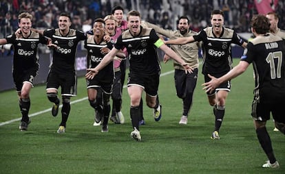 Ajax players celebrate moving onto the semifinals.