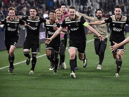 Ajax players celebrate moving onto the semifinals.