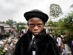 Natan Mahata, 8-year-old school student and sapeur for 3 years, in Kinshasa, 2019.

He wears jacket and hat by Zara, trousers by Place, shirt by Pierre Cardin, suspenders by Boris and shoes by JM Weston.