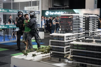 Mossos d'Escuadra police officers evict housing activists protesting against a real estate fair in Barcelona, Spain, on Oct. 19, 2022. 
