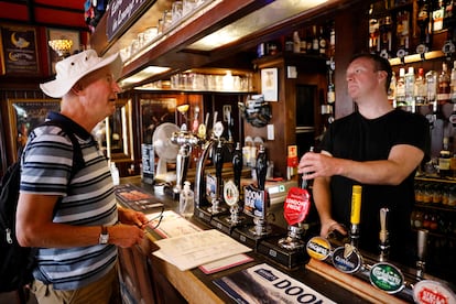 A patron in a London pub in July.