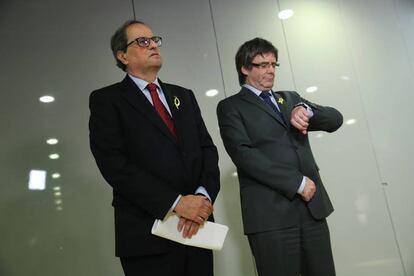 Newly elected Catalan premier Quim Torra and Carles Puigdemont.