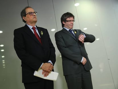 Newly elected Catalan premier Quim Torra and Carles Puigdemont.