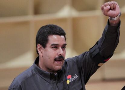 Interim President Nicol&aacute;s Maduro salutes the crowd at the opening of Caracas Book Fair on Wednesday.