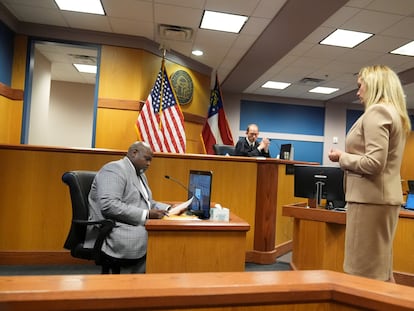 Attorney Ashleigh Merchant speaks with Terrence Bradley in court, in Atlanta, Georgia, U.S., February 27, 2024.