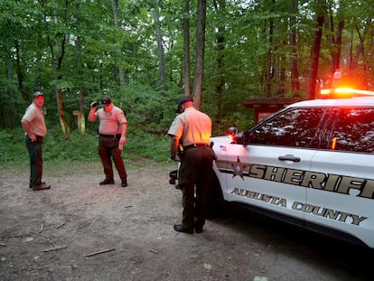Authorities secure the entrance to Mine Bank Trail, an access point to the rescue operation along the Blue Ridge Parkway where a Cessna Citation crashed over mountainous terrain near Montebello, Va., Sunday, June 4, 2023.
