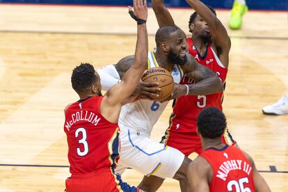 Los Angeles Lakers forward LeBron James (6) is fouled by New Orleans Pelicans forward Herbert Jones (5) as he goes to the basket during the second half at Smoothie King Center.