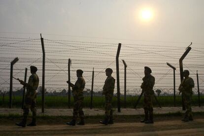 This photo taken on February 20, 2017 shows Indian Border Security Force (BSF) personnel patrolling along a fence at the India-Pakistan border, at Wagah some 35kms from Amritsar.
Built to keep out migrants, traffickers, or an enemy group, border walls have emerged as a one-size-fits-all response to the vulnerability felt by many societies in today's globalized world, says an expert on the phenomenon.
Practically non-existent at the end of World War II, by the time the Berlin Wall fell in 1989 the number of border walls across the globe had risen to 11.
That number has since jumped to 70, prompted by an increased sense of insecurity following the September 11, 2001 attacks in the United States and the 2011 Arab Spring, according to Elisabeth Vallet, director of the Observatory of Geopolitics at the University of Quebec in Montreal (UQAM).

This image is part of a photo package of 47 recent images to go with AFP story on walls, barriers and security fences around the world. More pictures available on afpforum.com / AFP PHOTO / NARINDER NANU