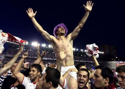 Rayo Vallecano player Francisco Medina celebrates with fans the club's survival after beating Granada.
