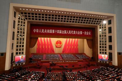 Delegates attend the closing ceremony for China's National People's Congress (NPC) as Chinese President Xi Jinping delivers a speech at the Great Hall of the People in Beijing, Monday, March 13, 2023.