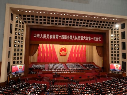 Delegates attend the closing ceremony for China's National People's Congress (NPC) as Chinese President Xi Jinping delivers a speech at the Great Hall of the People in Beijing, Monday, March 13, 2023.