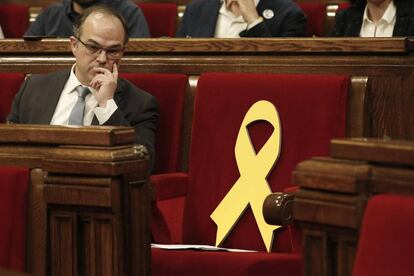 Catalan regional deputy Jordi Turull looks from his seat at the start of his investiture session.