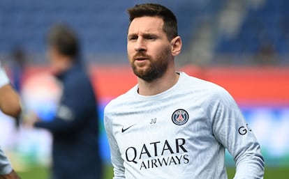 Paris Saint-Germain's Argentine forward Lionel Messi looks on as he warms up prior to the French L1 football match between Paris Saint-Germain (PSG) and FC Lorient at The Parc des Princes Stadium in Paris.