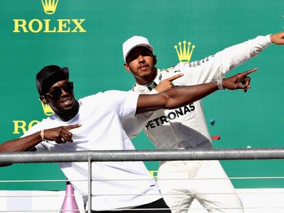 Usain Bolt y Hamilton, en el podio.