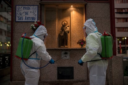 Municipal workers disinfecting a square in the Galician city of Ourense.