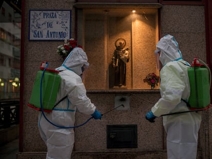 Municipal workers disinfecting a square in the Galician city of Ourense.