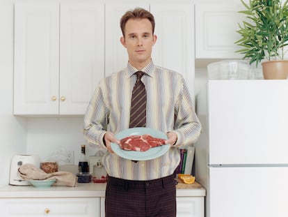 Man Holding Raw Steak on Plate