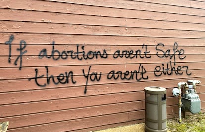 Threatening graffiti is seen on the exterior of Wisconsin Family Action offices in Madison, Wis., May 8, 2022