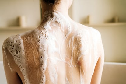 Woman taking a bubble bath