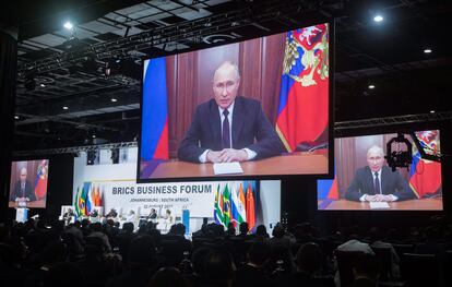 President of Russia Vladimir Putin appears on a monitor as he delivers a recorded speech off location during the 15th BRICS Summit in Johannesburg, South Africa, on August 22, 2023.