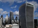 FILE PHOTO: The City of London financial district is seen with office skyscrapers commonly known as 'Cheesegrater', 'Gherkin' and 'Walkie Talkie' seen in London, Britain, January 25, 2018. Picture taken January 25, 2018.  REUTERS/Toby Melville/File Photo