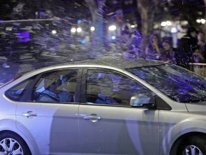 Members of the RTVV board are pelted with objects as they leave the station&#039;s headquarters.