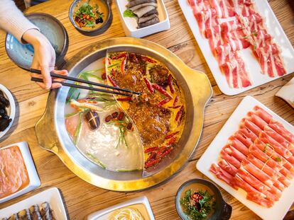 Chinese hot pot cooking involves picking your favorite ingredients and boiling them in broth at the dining table