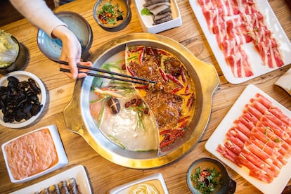 Chinese hot pot cooking involves picking your favorite ingredients and boiling them in broth at the dining table