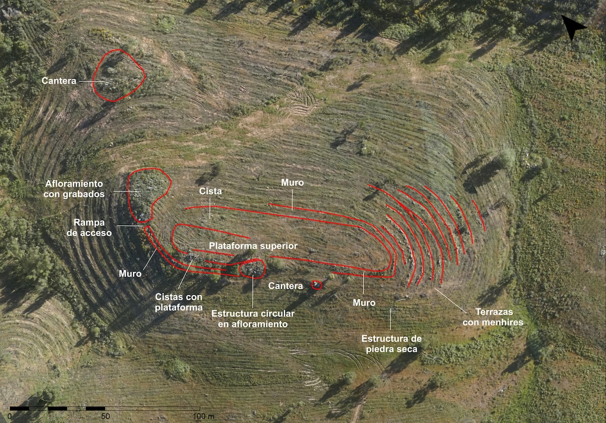 Aerial view of La Torre-La Janera megalithic site showing terraced hillsides with 526 ancient standing stones organized in straight lines and circular patterns across the Spanish landscape.