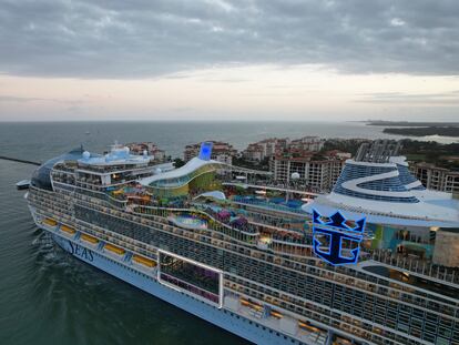 Icon of the Seas, the world's largest cruise ship, sails out of Government Cut past Fisher Island, Fla., right, as it departs PortMiami on its first public cruise, Saturday, Jan. 27, 2024. (AP Photo/Rebecca Blackwell)