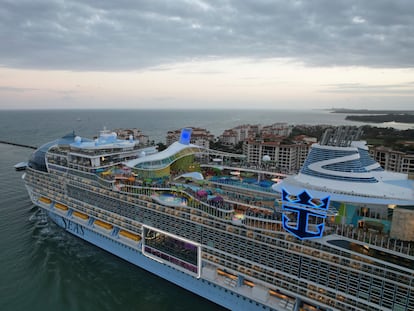 Icon of the Seas, the world's largest cruise ship, sails out of Government Cut past Fisher Island, Fla., right, as it departs PortMiami on its first public cruise, Saturday, Jan. 27, 2024. (AP Photo/Rebecca Blackwell)