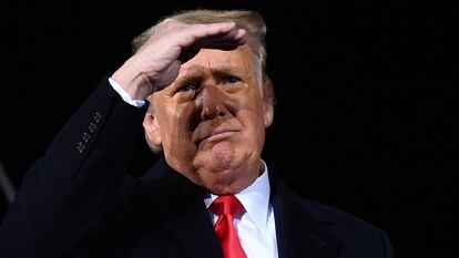 Then-president Donald Trump looks on during a rally in Dalton, Georgia, on January 4, 2021.