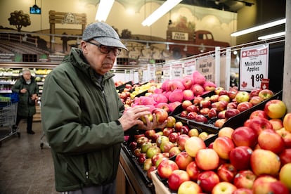 Mohammed Lahbabi buying Canadian apples on February 7 at Farm Boy, a supermarket in Westboro, a well-to-do neighborhood of Ottawa.