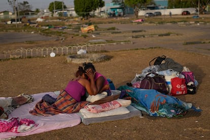 A Venezuelan migrant cries with her daughter in Boa Vista, Roraima state, Brazil