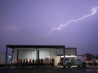 A U.S. border patrol guards a group of migrants in Fronton, Texas, on May 12.