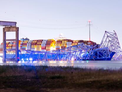 The Francis Scott Key Bridge rests partially collapsed after a container ship ran into it in Baltimore, Maryland.