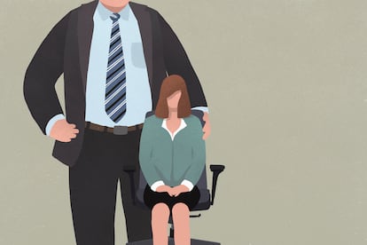 Businesswoman sitting in office chair next to giant man in suit