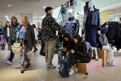 Shoppers look for early Black Friday sales at a Gap Store in Times Square on the Thanksgiving holiday in New York City, U.S.