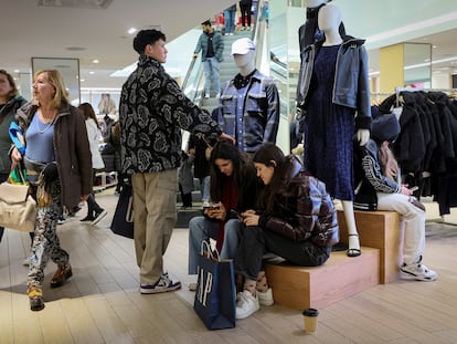 Shoppers look for early Black Friday sales at a Gap Store in Times Square on the Thanksgiving holiday in New York City, U.S.