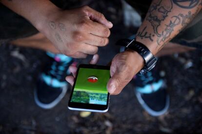 A man plays "Pokemon GO" in the small town of Occoquan, Virginia, U.S. August 14, 2016. REUTERS/Sait Serkan Gurbuz