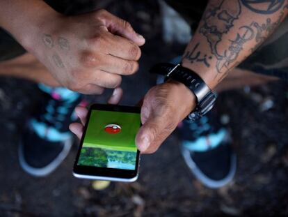 A man plays "Pokemon GO" in the small town of Occoquan, Virginia, U.S. August 14, 2016. REUTERS/Sait Serkan Gurbuz