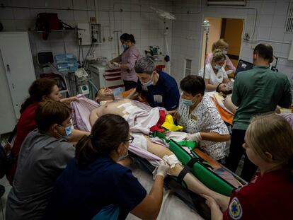 Medical staff move a seriously wounded Ukrainian serviceman at the ICU department of Mechnikov Hospital in Dnipro, Ukraine, Friday, July 14, 2023.